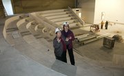From left, Eleanor Woodyard and Mary Doveto, executive director of Theatre Lawrence, tour the construction of Theatre Lawrence's new building, 4660 Bauer Farm Drive.