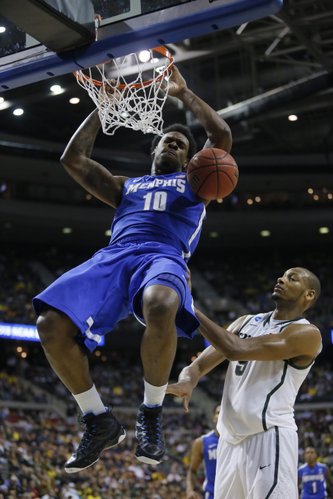 Memphis forward Tarik Black dunks against Michigan State forward Adreian Payne (5) in the second half of a third-round game of the NCAA college basketball tournament Saturday, March 23, 2013, in Auburn Hills, Mich.