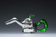 Kansas University graduate student Eli Gold re-created a fifth-grader's elephant-inspired clay teapot design in sterling silver. The "Elepot," which Gold hopes to sell to benefit the Boys and Girls Club of Lawrence, is the culmination of his project, "From Their Hands to Mine."