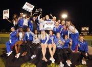 Members of Kansas University’s women’s track and field team celebrate the school’s first Big 12 Outdoor title on Sunday, May 5, 2013, in Waco, Texas.