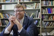 KU communications studies professor Dave Tell won an award from the National Communication Association for a research project on Truman Capote's "In Cold Blood" and how Kansans had different reactions to the book depending on where they lived.