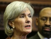 FILE - In this Feb. 20, 2013 file photo, Health and Human Services Secretary Kathleen Sebelius, accompanied by Philadelphia Mayor Michael Nutter, speaks about the federal health care overhaul during a news conference at City Hall in Philadelphia.