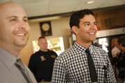Iraq War veteran Johnathan Duncan, right, laughs with Michael Siroky, also an Iraq War veteran, as the two socialize with other vets on Thursday, May 24, 2013 during a ribbon-cutting ceremony for the opening of the new Veterans of Foreign Wars Post 852 building at 1801 Massachusetts. Duncan, who says he has experienced bouts of post traumatic stress disorder since his service, says he finds comfort in being able to assist other veterans by being involved in veterans issues and service activities.