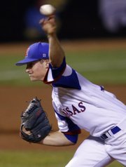 Kansas’ Wes Benjamin pitches against Oklahoma State during the Big 12 tournament on Friday in Oklahoma City. KU won, 5-3, to improve to 2-0 in its pool.