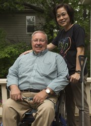 Yen Vo, right, stands next to her former Kansas University adviser, Professor Glen White. Vo, who graduated with a master's degree in 2004, has been a leader in advocating for rights of people with disabilities in Vietnam.