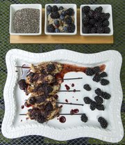 Vanilla Chia Pudding with Blackberries and Blueberries, pictured at top, and Chicken Satay with Blackberry-Ginger Sauce utilize this month’s Delicious/Nutritious ingredient of blackberries in different ways.