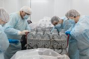 Workers prepare an animal housing unit before the launch of the Bion-M1 satellite in Russia in April.