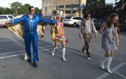 Former Kansas player Greg Gurley shows off his blue suit and side burns as he heads into Abe and Jake's Landing for the annual Bill Self Basketball Boogie, Saturday evening.