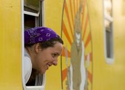 England Porter, Lawrence, one of the co-owners of the Blissful Bite food truck, talks to customers during the annual Relay for Life event, held Friday, June 7, 2013, at Free State High School.
