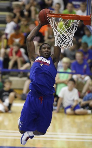 Blue team forward Jamari Traylor elevates to the bucket during a scrimmage on Wednesday, June 12, 2013 at the Horejsi Center.