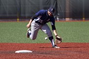 The Raiders' shortstop Shane Willoughby fields a ground ball during the Raiders' game against the Missouri Bucks Saturday at Lawrence High.