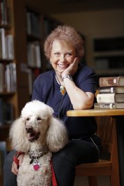 After 46 years on the job, Lawrence High librarian Martha Oldham is retiring. Oldham is pictured with her poodle, Murphy, whom she plans to spend plenty of time with during her retirement.
