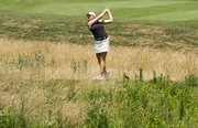 Meghan Potee hits onto the green on the 16th hole at the Lawrence Country Club course on Sunday, July 14, 2013, during the Lawrence City Golf Tournament.