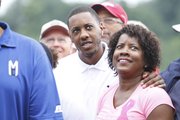 Mario Chalmers, center, and his mom, Almarie, wait the start of Mario's benefit golf tournament on Monday, July 29, 2013, at Alvamar.