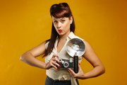 Lawrence pinup photographer Emmalee Schaumburg of Bombshell is pictured in her studio, 613 N. Second St., on Aug. 13, 2013. When asked how she gets her clients to rid themselves of photoshoot jitters, Schaumburg joked, "We serve wine."