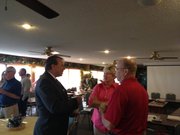Gov. Sam Brownback's Budget Director Steve Anderson (left) speaks with Kansas Board of Regents members Robba Moran and Kenny Wilk on Wednesday prior to a budget discussion during the board's annual retreat held at Valley Falls.
