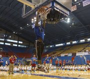 Former Kansas University forward Thomas Robinson, a member of the Portland Trail Blazers, throws down a dunk during a game of J-A-Y as campers watch during the Bill Self basketball camp held Sunday, Aug. 18, 2013, at Allen Fieldhouse.