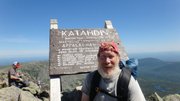 Lawrence paraeducator Mike Harris finishes his four-month trek of the Appalachian Trail on July 13, at Mount Katahdin in Maine, his beard quite longer than when he started.