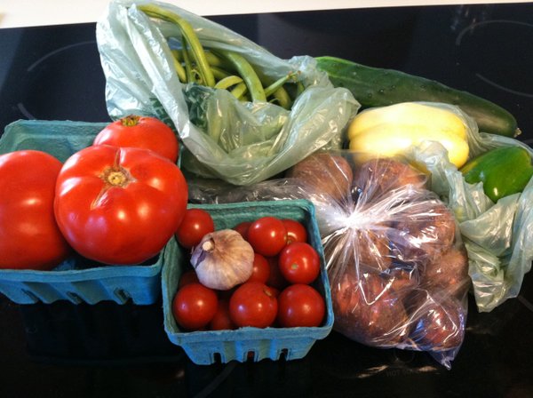 Tomatoes, cucumbers, garlic, green beans, bell peppers and potatoes.