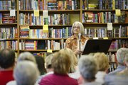 Author Cathy Callen reads to a packed audience on Thursday, Sept. 5, 2013, at The Raven bookstore, 6 E. Seventh St.