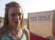 Andrea Geubelle stops to speak with the media on the red carpet during the Rock Chalk Choice Awards Sunday at the Lied Center.