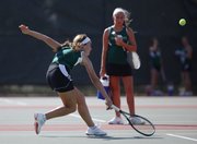 Free State No. 2 singles player Megan McReynolds reaches for a return during her first-round match against Lawrence High's Kendall Pritchard, Tuesday, Sept. 10, 2013 at Lawrence High School.