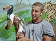 Tim Emerson, owner of Pet World, breeds animals, like this female Ball Python, goes to schools to educate kids in reptiles and animal care and provides jobs for teens.