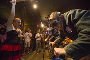 Frank's North Star Tavern owner Frank Dorsey, disguised as Jason Voorhees competes in a roller cycling race at Franks North Star Tavern, 508 Locus Street, on Friday, Sept. 13, 2013 while Michele Berendsen holds his machete while cheering him on.