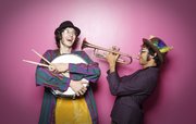 Lawrence residents Tim Clark, left, and friend, Rayyan Kamal say that they get a lot of enjoyment from playing music for various musicals, community parades like Art Tougeau or even starting their own impromptu, mini parades on the campus of Kansas University.