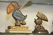These Jayhawks are part of Bud Jennings' lifetime collection. At left is a Jayhawk with a piece of original flooring from Robinson Gym.