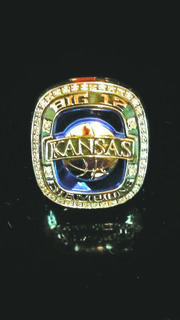Rings marking Kansas University’s 2013 Big 12 basketball championship arrived this week. Coach Bill Self planned to used their distribution to inspire his freshmen. This particular ring — posted on Twitter — belongs to strength coach Andrea Hudy.