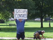 Steve Robinson, an activist in the Occupy Lawrence movement in 2011, was among a handful of protesters demonstrating at South Park today against the ongoing federal government shutdown. Robinson says the shutdown should reignite the populist street movement that initially focused on economic and social justice issues.