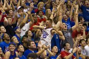 Fans go wild during the "Jawhaks in the NBA" part of Late Night in the Phog Friday at Allen Fieldhouse.