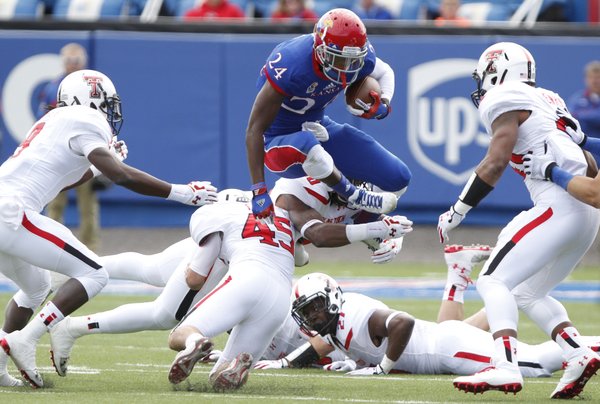 Kansas kick returner JaCorey Shepherd looks to hurdle a Texas Tech special teams play during a return in the second quarter on Saturday, Oct. 5, 2013 at Memorial Stadium.