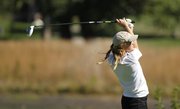 Free State junior Karen Campbell watches a drive during the Free State Invitational on Monday, Oct. 7, 2013 at Lawrence Country Club.
