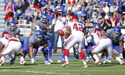 Kansas quarterback Montell Cozart takes a snap against Oklahoma during the second quarter on Saturday, Oct. 19, 2013 at Memorial Stadium.