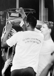 Danny Manning, left, and Chris Piper finish off cutting down the nets in Kemper Arena on April 4, 1988, after defeating Oklahoma 83-79 in the NCAA title game.