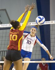 Kansas' Tayler Soucie hits a spike past Iowa State's Victoria Hurtt during their volleyball match Wednesday evening at the Horejsi Center.