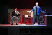 Sweeney Todd, played by Mark Rector, right, prepares to give "a shave" to the Judge Turpin, played by Patrick Kelly, during a dress rehearsal for Sweeney Todd: The Demon Barber of Fleet Street, Tuesday, Oct. 22, 2013 at the Lawrence Arts Center.