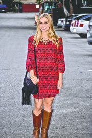 Prints for a day. Elizabeth Kennedy wears a standout print dress ($35), bracelets ($15 each) necklace ($30, part of matching earrings set) and bag ($60), all from Britches, 843 Massachusetts St. A sassy print is a must-have this fall, be it a dress or accessories.