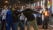Kansas basketball player Justin Wesley pushes off Niko Roberts as they play an impromptu game of one-on-one with a mini basketball Sunday afternoon at Abe & Jake's Landing.