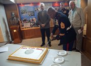 Marines are celebrating the 238th birthday of the Corps. David Hakim Jr., a U.S. Marine from Cleveland, Ohio, cuts the cake. Looking on, from left, are as Lt. Col. (ret.) Perry Puccetti, Edward Stimac, 29, Kansas City, Kan., and James Stokes, 90, of Lawrence.