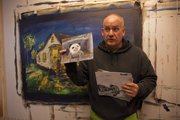 Dave DeHetre is taking on the challenge of writing a 50,000-word novel in 30 days. Standing in his studio, he describes illustrations he painted for previous novels.