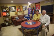 Beth and Marshall Kelley's Jayhawk-themed basement makes a good backdrop for game-watching (unless they're at Allen Fieldhouse) or family game nights. Almost every item comes with a memory, the Lawrence couple said.
