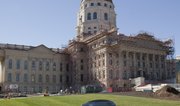 The multi-phase Kansas Statehouse restoration, currently underway, includes restoration of the first through fifth floors, rehabilitation/expansion of the basement, complete exterior masonry restoration, copper roof and copper dome restoration.