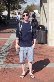 Clothing details: Sunglasses, Sun Glass Hut, $98; Vancouver Grizzlies Hat, found it; fraternity shirt, $15; J.Crew shorts, I don’t remember the price; rainbow sandals, $100.