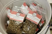 Gary and Angie Rexroad, along with their dog Rex, all from Lawrence, have developed a line of dog food called Love Grub. The food is available at Pawsh Wash, Lawrence Feed and Farm, Lucky Paws, both Hy-Vee locations and Checkers.
