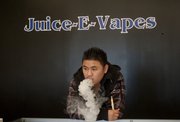 Jack Tran, owner of Lawrence electronic cigarette store Juice-E-Vapes, said he used the devices to kick his own smoking habit.