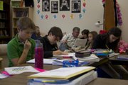 Students in Krista Barbour's class at Bishop Seabury Academy spend about 35 minutes per day working on their novels for National Novel Writing Month. From left, Ian Hannah, Logan Mathis, Ben Miller, Mike Maude with his grandson, Malcolm Maude, Emily Heinz and Siena Casagrande.