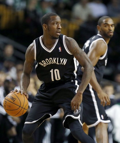 Brooklyn Nets' Tyshawn Taylor (10) plays against the Boston Celtics in the first quarter of a preseason NBA basketball game in Boston, Wednesday, Oct. 23, 2013. (AP Photo/Michael Dwyer)